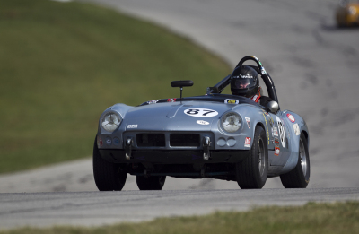 Don Couch staying focused in his 1962 Triumph Spitfire