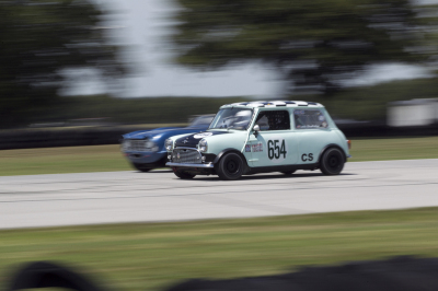Louis Gladfelter in his Mini trying to hold off Bob Kramer in his Triumph TR4