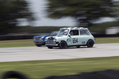 Louis Gladfelter in his Mini trying to hold off Bob Kramer in his Triumph TR4 Louis Gladfelter in his Mini trying to hold off Bob Kramer in his Triumph TR4