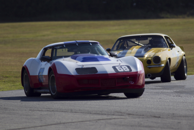 Marty Baker in his Corvette leading Mark Hannifin in Jim Sharps Camaro