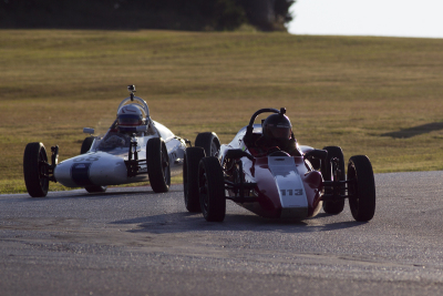 Moody shot of Hunter Phelps Barron and Bill Wolff into Turn 2