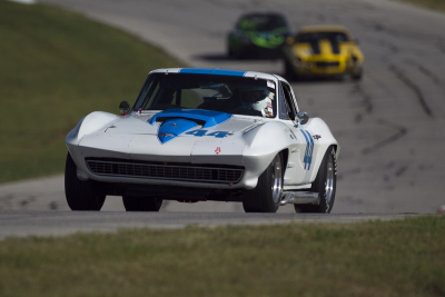George Wright in his 1963 Chevy Corvette up Dam hill at Hallett