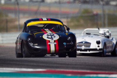Marcus Pillion and his ominous Porsche 356B Coupe leading over Paul Konkle Jr in his 1962 MG B Marcus Pillion and his ominous Porsche 356B Coupe leading over Paul Konkle Jr in his 1962 MG B